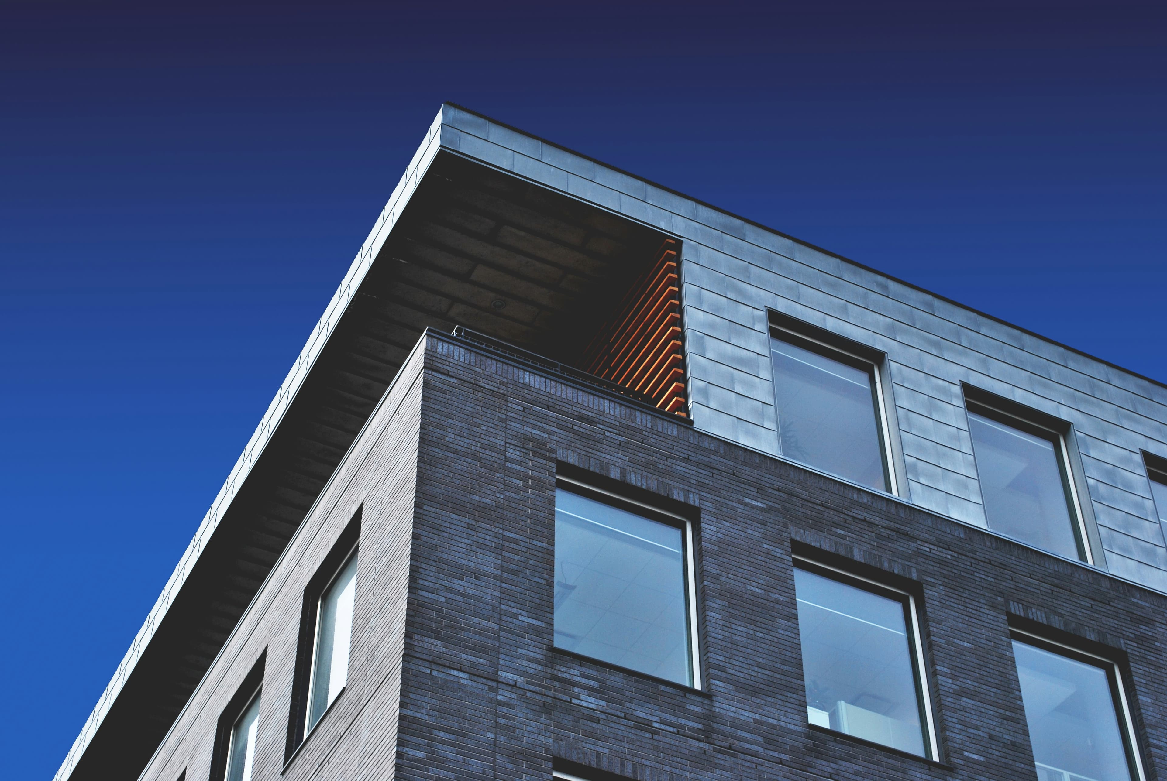 Modern building facade against a blue sky